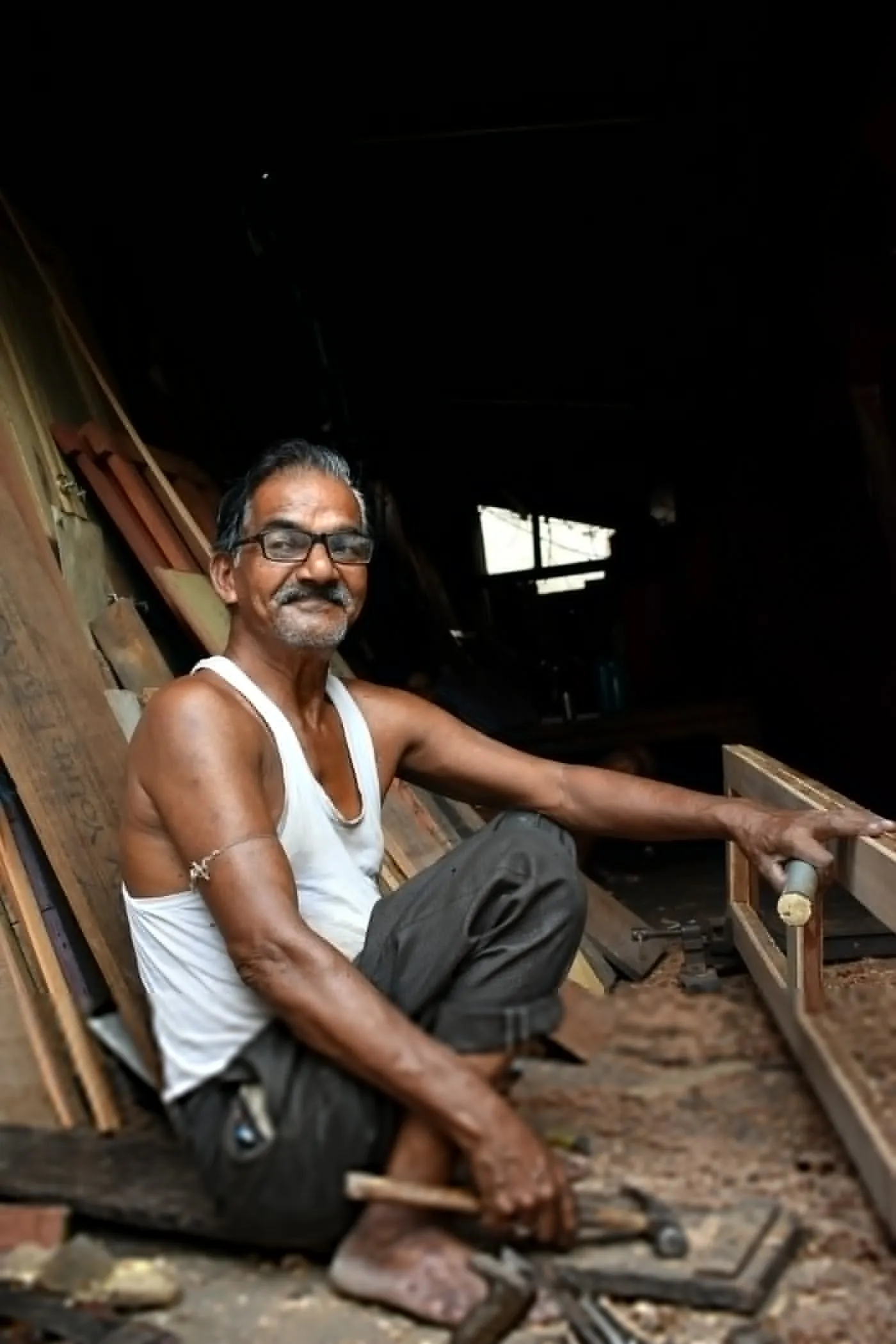 Carpentry: a carpenter shaping timber